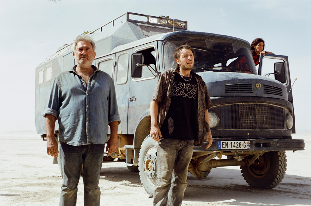 This image released by Neon shows, from left, Sergi López, Joshua Liam Henderson, and Stefania Gadda in a scene from the film "Sirat." (Neon via AP)