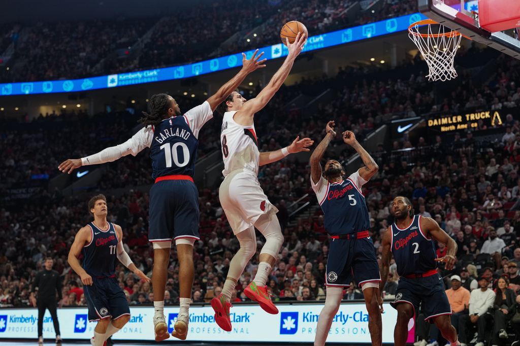 Portland Trail Blazers forward Deni Avdija (8) goes to the basket during the first half of an NBA basketball game against the Los Angeles Clippers, Friday, April 10, 2026, in Portland, Ore. (AP Photo/Jenny Kane)