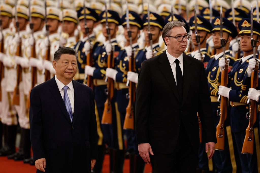 Chinese President Xi Jinping and Serbian President Aleksandar Vucic, right, review the honour guard at a welcoming ceremony at the Great Hall of the People, in Beijing, China, Monday May 25, 2026. (Tingshu Wang/Pool Photo via AP)