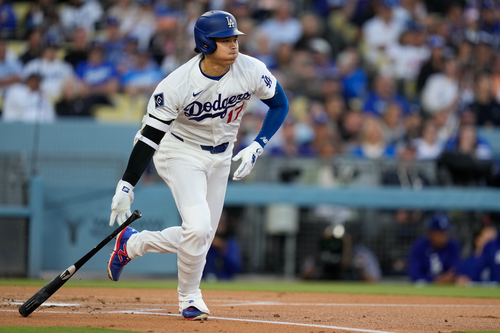 Los Angeles Dodgers' Shohei Ohtani heads to first for a single during the first inning of a baseball game against the Los Angeles Dodgers, Tuesday, May 12, 2026, in Los Angeles. (AP Photo/Mark J. Terrill)