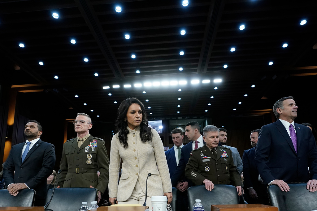 From left, FBI Director Kash Patel, Defense Intelligence Agency Director James Adams, Director of National Intelligence Tulsi Gabbard, Acting Commander of the U.S. Cyber Command William Hartman, and CIA Director John Ratcliffe stand before the Senate Committee on Intelligence hearings to examine worldwide threats on Capitol Hill Wednesday, March 18, 2026, in Washington. (AP Photo/Jose Luis Magana)