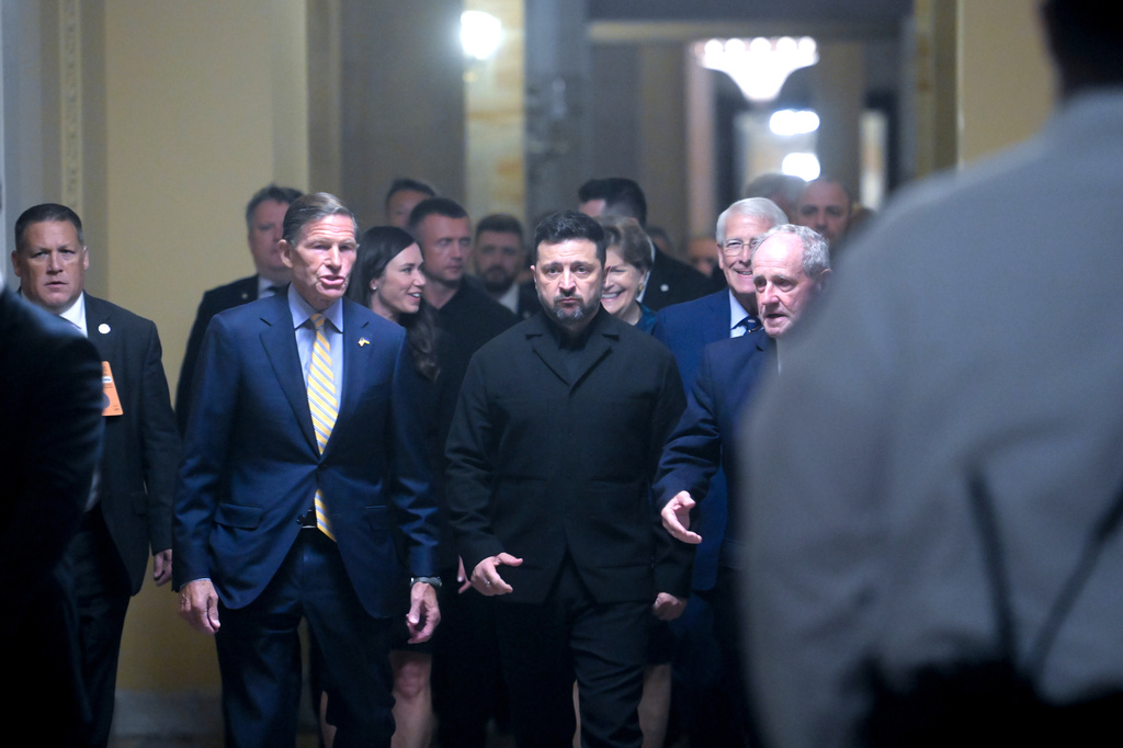 Ukraine President Volodymyr Zelenskyy, center, is joined by from left: Sen. Richard Blumenthal, D-Conn., Sen. Katie Boyd Britt, Sen. Jeanne Shaheen, D-N.H., R-Ala., Sen. Roger Wicker, R-Miss., and Sen. James Risch, R-Idaho, as he arrives at the U.S. Capitol for a meeting of bipartisan leaders of the Lindsey O. Graham Sanctioning Russia and Iran Act of 2026, Tuesday, July 28, 2026, in Washington. (AP Photo/Rod Lamkey, Jr.)