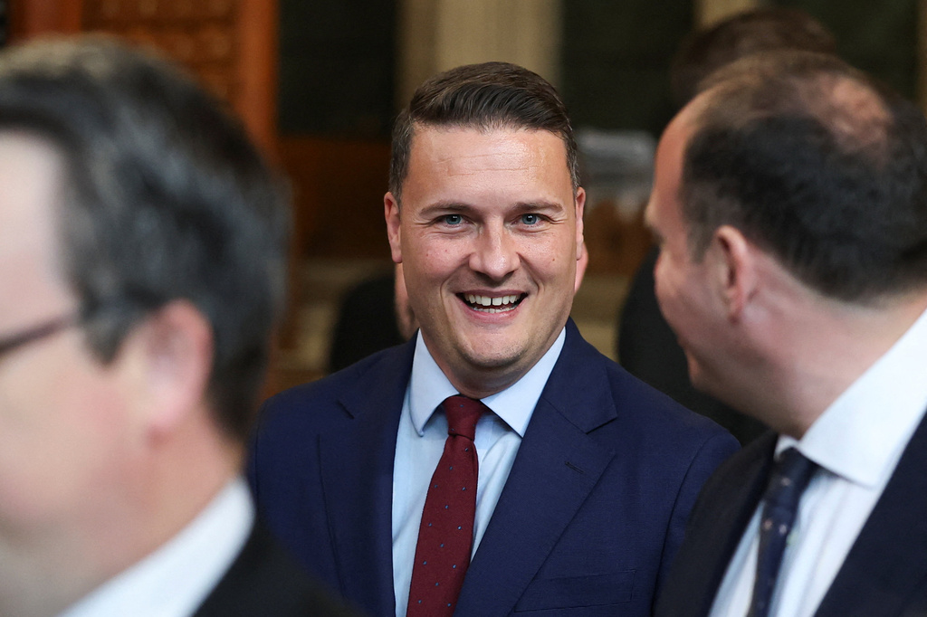 British Health Secretary Wes Streeting walks through the House of Commons to attend the State Opening of Parliament at the Palace of Westminster, London, Wednesday, May 13, 2026. (Toby Melville/Pool Photo via AP)