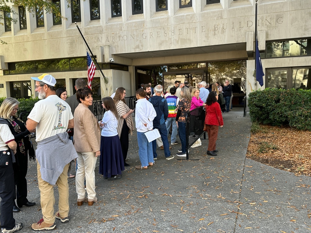 People line up outside the Gressette Building for a South Carolina Senate subcommittee on a bill that would ban almost all abortions on Tuesday, Nov. 18, 2025, in Columbia, S.C. (AP Photo/Jeffrey Collins)