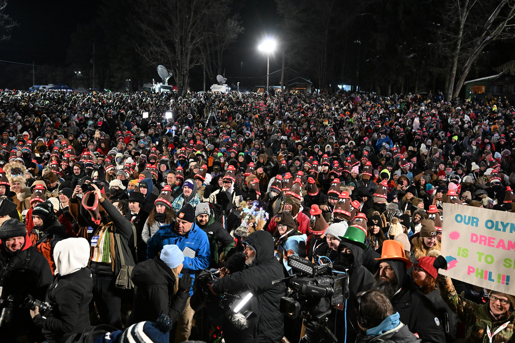 A crowd gathers while waiting for Punxsutawney Phil, the weather prognosticating groundhog, to come out and make his prediction during the 140th celebration of Groundhog Day on Gobbler's Knob in Punxsutawney, Pa., Monday, Feb. 2, 2026. (AP Photo/Barry Reeger)