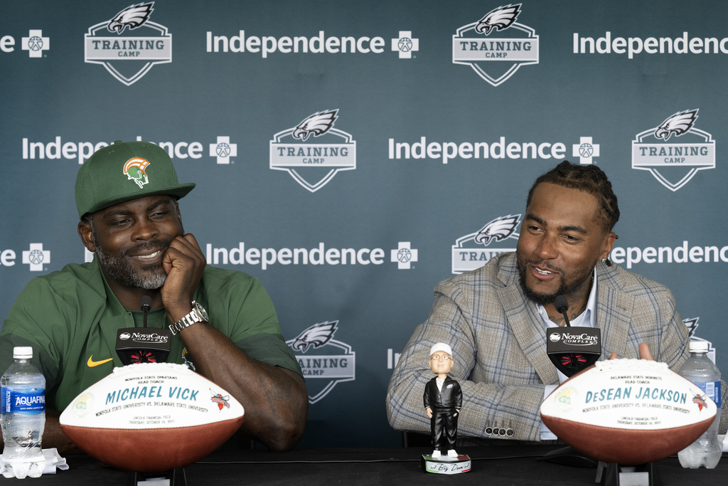 Former Philadelphia Eagles stars Michael Vick, left, and DeSean Jackson address the media at the Eagles' NFL football training camp Tuesday, Aug. 12, 2025, in Philadelphia. Now head coaches at Norfolk State and Delaware State respectively, Vick and Jackson are set to face off in a highly anticipated matchup on Oct. 30 at Lincoln Financial Field. (Jose F. Moreno/The Philadelphia Inquirer via AP)