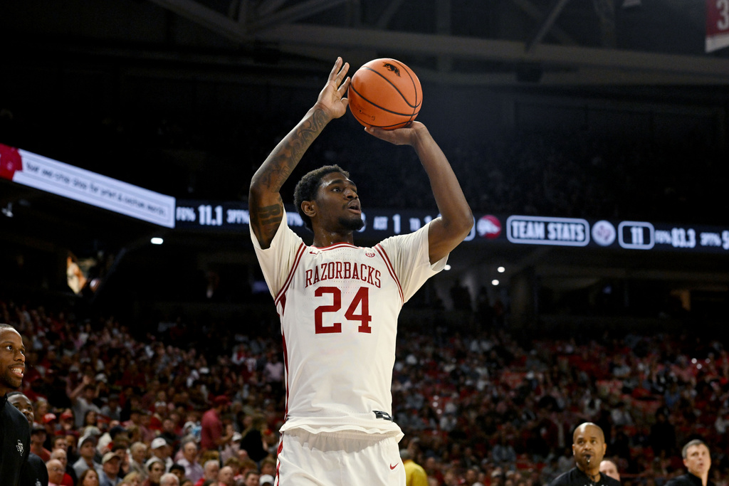 Arkansas guard Billy Richmond III shoots a 3-point shot against Texas A&M during an NCAA college basketball game, Wednesday, Feb. 25, 2026, in Fayetteville, Ark. (AP Photo/Michael Woods)