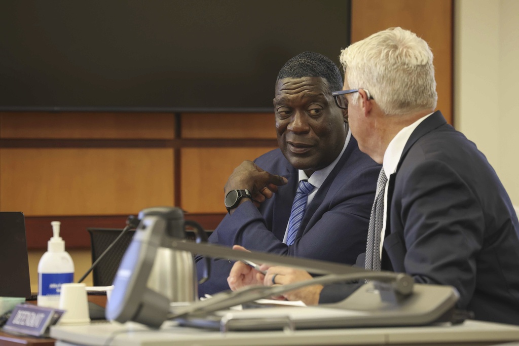 Former Seattle Sonics basketball player Shawn Kemp, left, and defense attorney Timothy Lear, speak following Kemp's sentencing at Pierce County Superior Court in Tacoma, Wash., Friday, Aug. 22, 2025. (Ivy Ceballo/The Seattle Times via AP)