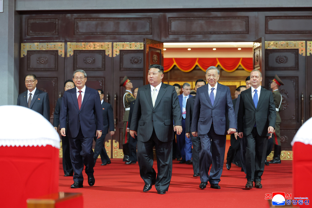 In this photo provided by North Korean government, North Korean leader Kim Jong Un, center, Chinese Premier Li Qiang, front left, Vietnamese Communist Party General Secretary To Lam, second from right, Russian Security Council Deputy Chairman Dmitry Medvedev, right, attend a ceremony marking the 80th anniversary of the founding of North Korea's ruling Worker's Party of Korea, in Pyongyang, North Korea, Thursday, Oct. 9, 2025. Independent journalists were not given access to cover the event depicted in this image distributed by the North Korean government. The content of this image is as provided and cannot be independently verified. Korean language watermark on image as provided by source reads: "KCNA" which is the abbreviation for Korean Central News Agency. (Korean Central News Agency/Korea News Service via AP)