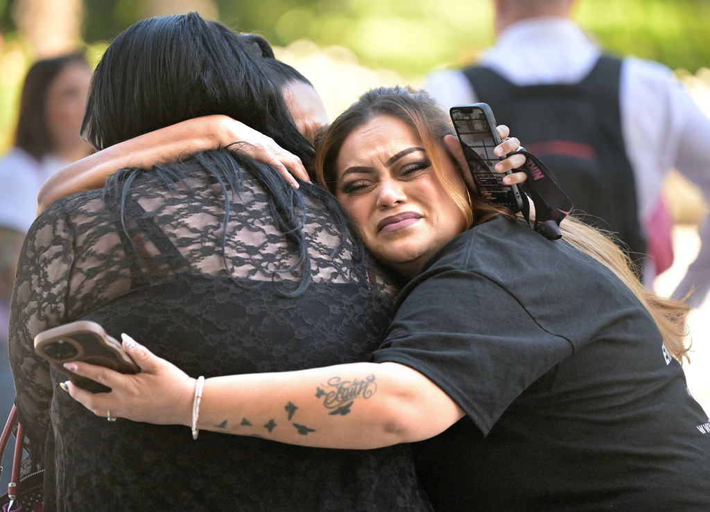 Carla Jaramillo, right, embraces Ashley Roe and Ramona Munoz, who have all been closely following the Haro case, embrace outside of the Riverside Hall of Justice in downtown Riverside on Thursday, Oct. 16, 2025.(Will Lester/The Orange County Register via AP, Pool)
