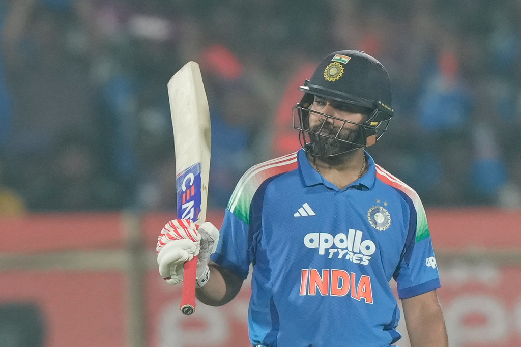 India's Rohit Sharma celebrates his fifty runs during the third One Day International cricket match between India and South Africa in Visakhapatnam, India, Saturday, Dec. 6, 2025. (AP Photo/Mahesh Kumar A.)