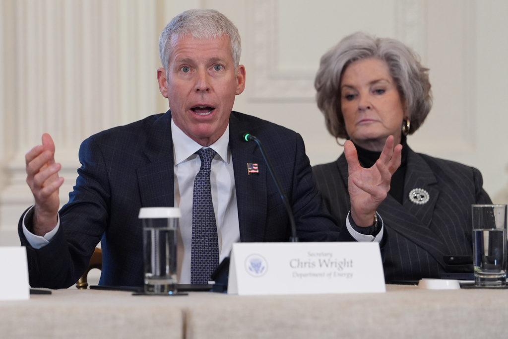 FILE - Energy Secretary Chris Wright speaks as White House chief of staff Susie Wiles listens during a meeting with President Donald Trump and oil executives in the East Room of the White House, Friday, Jan. 9, 2026, in Washington. (AP Photo/Evan Vucci, File)