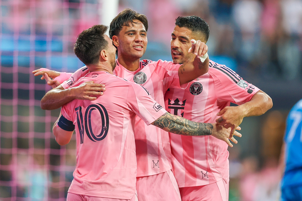 From left, Inter Miami forward Lionel Messi (10), midfielder Telasco Segovia (8) and forward Luis Suárez (9) celebrate a goal together in the first half during an MLS soccer match against the Orlando City, Saturday, May 2, 2026, in Miami. (AP Photo/Chris Arjoon)