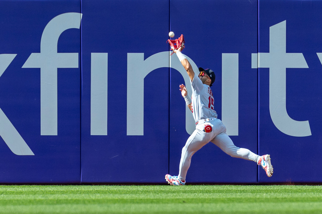 St. Louis Cardinals left fielder José Fermín catches a fly ball hit by Philadelphia Phillies' Bryson Stott in the sixth inning of a baseball game, Sunday, Aug. 23, 2026, in Philadelphia. (AP Photo/Laurence Kesterson)