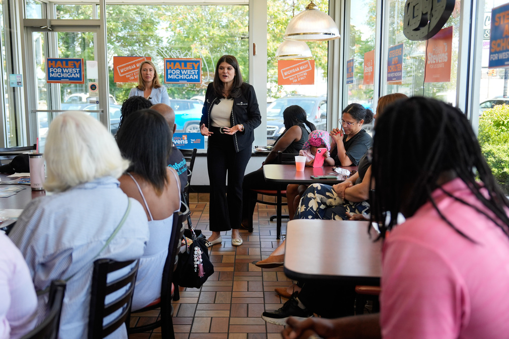 Rep. Haley Stevens, D-Mich., a candidate in the Democratic primary for U.S. Senate in Michigan, speaks during a campaign event at Corine's Soul Food, Cakes & Catering Monday, Aug. 3, 2026, in Muskegon Heights, Mich. (AP Photo/Paul Sancya)
