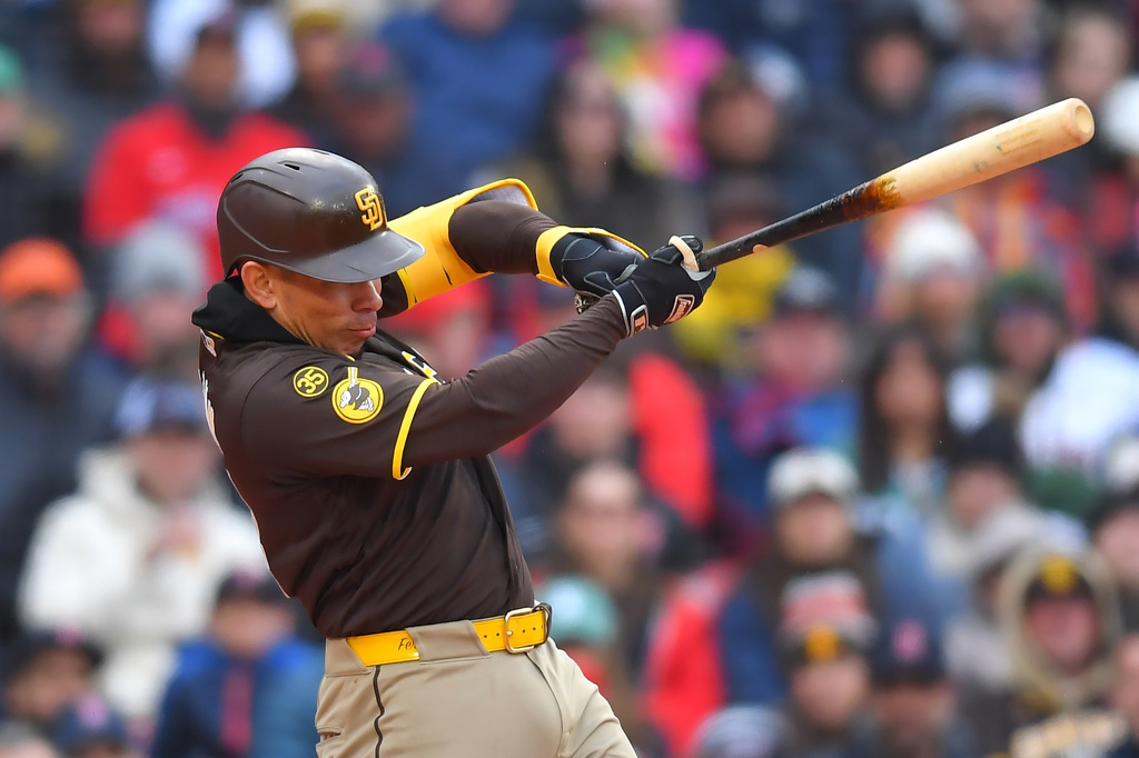 San Diego Padres' Freddy Fermin hits a one-run double allowing Miguel Andujar to score in the third inning of a baseball game against the Boston Red Sox, Saturday, April 4, 2026, in Boston. (AP Photo/Steven Senne)