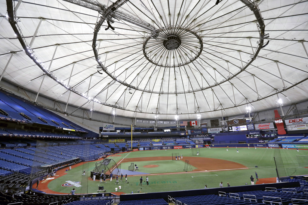 FILE - Members of the Tampa Bay Rays take batting practice at Tropicana Field before a baseball game against the Toronto Blue Jays, July 24, 2020, in St. Petersburg, Fla. (AP Photo/Chris O'Meara, File)