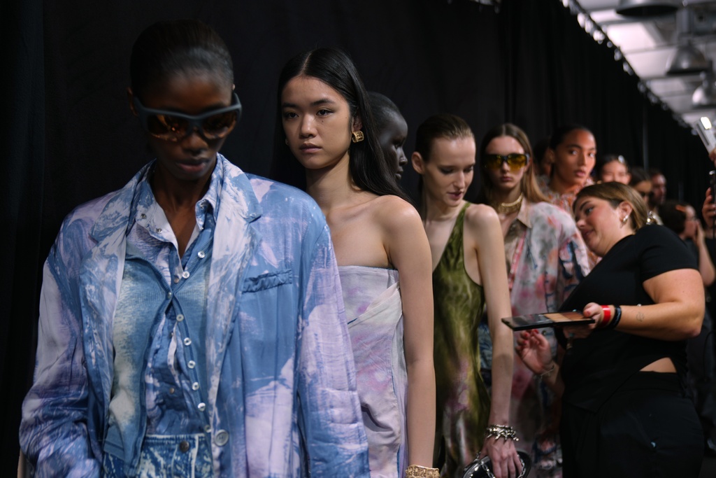 Models wear creations part of the Diesel's Spring Summer 2026 collection in the backstage ahead of the collection's show, in Milan, Italy, Tuesday, Sept. 23, 2025. (AP Photo/Antonio Calanni)