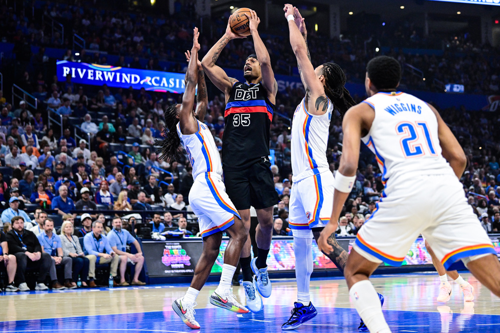 Detroit Pistons forward Tolu Smith (35) shoots the ball during the first half of an NBA basketball game against the Oklahoma City Thunder Monday, March. 30, 2026, in Oklahoma City. (AP Photo/Gerald Leong)