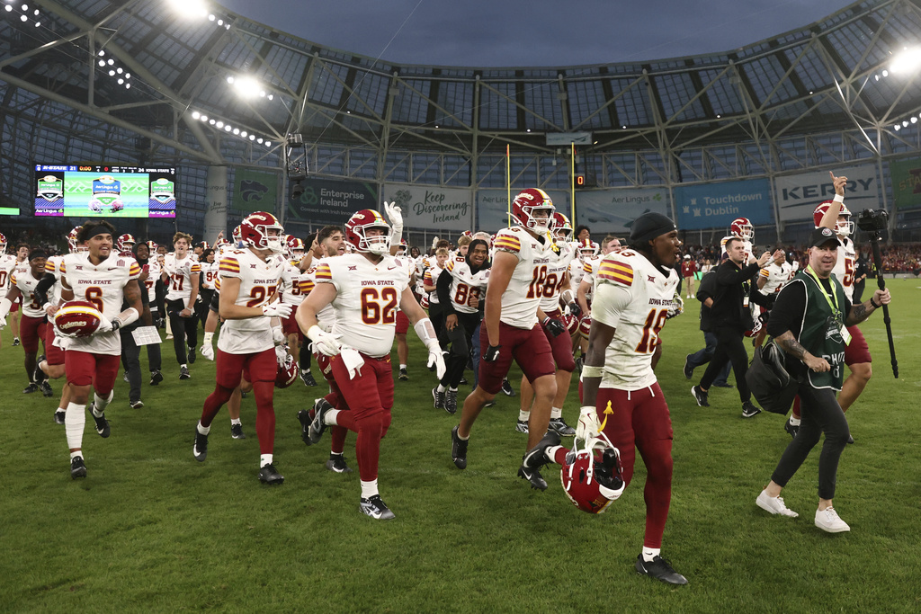 Iowa State players celebrate after winning an NCAA college football game between Iowa State and Kansas State in Dublin, Ireland Saturday, Aug. 23, 2025. (AP Photo/Peter Morrison)