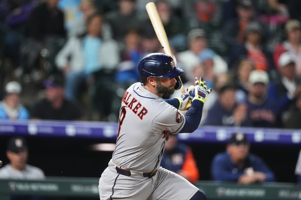 Houston Astros' Christian Walker grounds out against Colorado Rockies relief pitcher Antonio Senzatela to end a baseball game Tuesday, April 7, 2026, in Denver. (AP Photo/David Zalubowski)