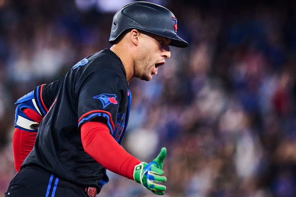 Toronto Blue Jays' George Springer reacts as he rounds the bases after hitting a solo home run during the fifth inning of a baseball game against the Seattle Mariners in Toronto, Friday, Aug. 28, 2026. (Sammy Kogan/The Canadian Press via AP)