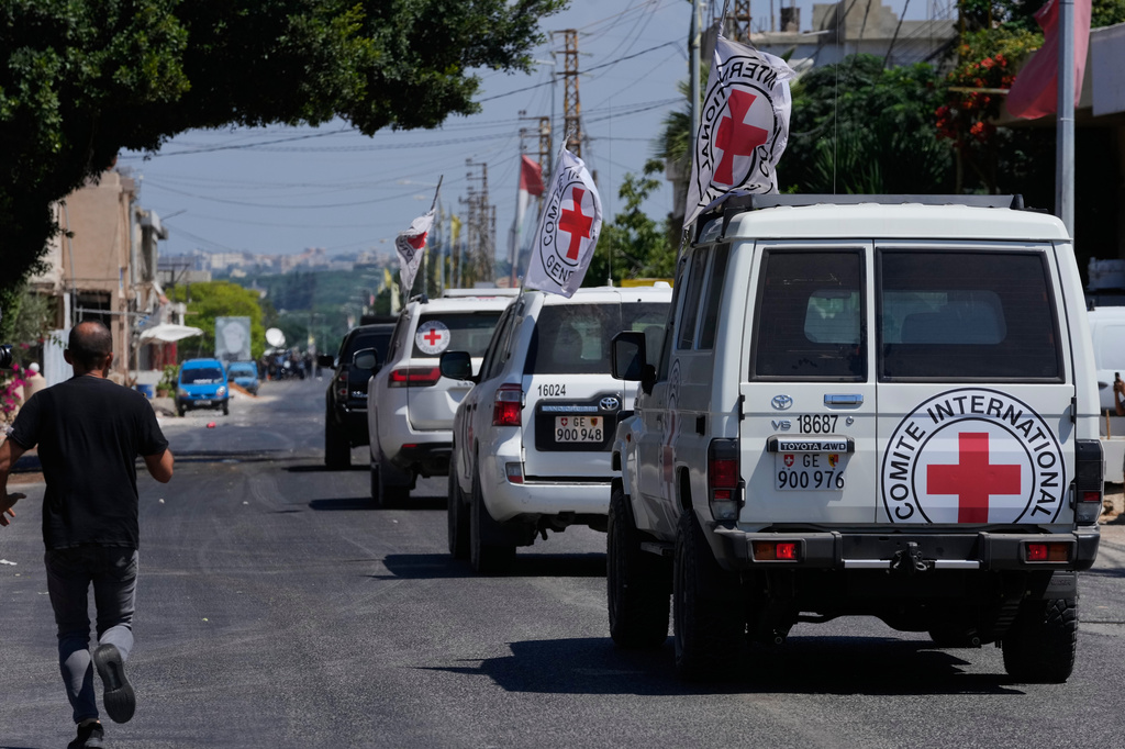 A Red Cross convoy escorts four released prisoners who were held in Israeli prisons as they arrive in the southern village of Mansouri, Lebanon, Friday, Sept. 4, 2026. (AP Photo/Mohammed Zaatari)