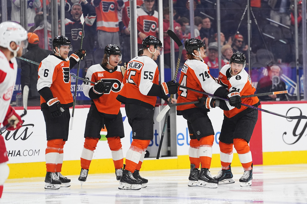 Philadelphia Flyers' Tyson Foerster, right, celebrates a goal past Detroit Red Wings goaltender John Gibson with teammates, from left, Travis Sanheim, Trevor Zegras, Rasmus Ristolainen, Owen Tippett during the second period of an NHL hockey game, Thursday, April 2, 2026, in Philadelphia. (AP Photo/Matt Rourke)