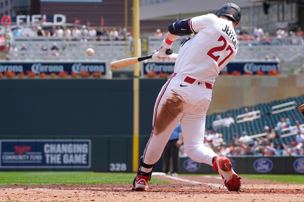 Minnesota Twins' Ryan Jeffers hits a two-run single against the Athletics in the second inning of a baseball game Sunday, July 26, 2026, in Minneapolis. (AP Photo/Bruce Kluckhohn)