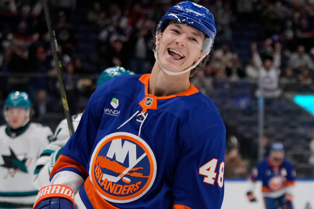 FILE - New York Islanders' Matthew Schaefer (48) smiles after scoring a goal during the second period of an NHL hockey game against the San Jose Sharks, Oct. 21, 2025, at UBS Arena in Elmont, N.Y. (AP Photo/Frank Franklin II, file)
