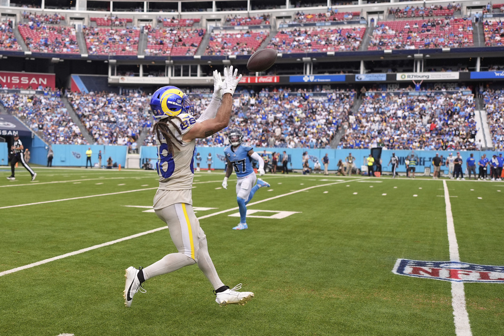 Los Angeles Rams wide receiver Jordan Whittington, left, makes a catch as Tennessee Titans safety Amani Hooker defends during the second half of an NFL football game Sunday, Sept. 14, 2025, in Nashville, Tenn. (AP Photo/George Walker IV)