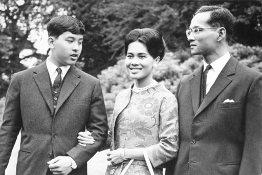 FILE - King Bhumibol of Thailand, right, walks with his wife Queen Sirikit, center, and their 13-year-old son Crown Prince Vajiralongkorn through the gardens of their residence at Sunninghill, Berkshire, July 27, 1966, where they are staying during their private visit to Britain. (AP Photo/Harris, File) FILE - King Bhumibol of Thailand, right, walks with his wife Queen Sirikit, center, and their 13-year-old son Crown Prince Vajiralongkorn through the gardens of their residence at Sunninghill, Berkshire, July 27, 1966, where they are staying during their private visit to Britain. (AP Photo/Harris, File)