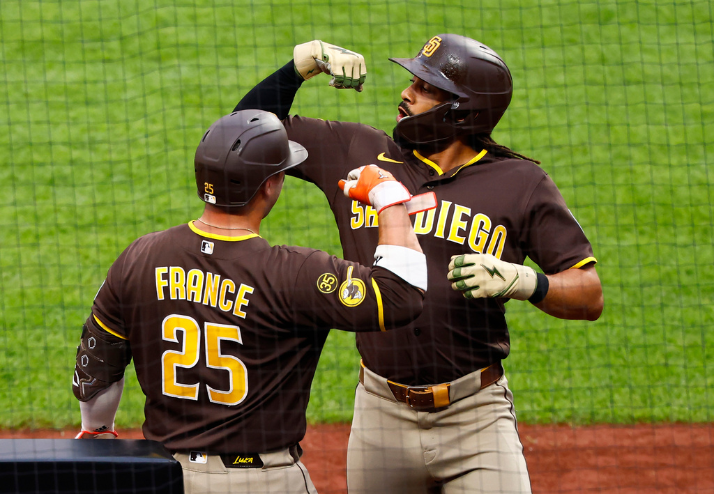 San Diego Padres' Fernando Tatis Jr. celebrates with Ty France (25) after hitting a home run against the New York Mets during the first inning of a baseball game, Tuesday, Aug. 18, 2026, in New York. (AP Photo/Noah K. Murray)