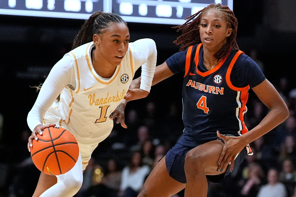 Vanderbilt guard Mikayla Blakes (1) dribbles the ball past Auburn guard Kaitlyn Duhon (4) during the first half of an NCAA college basketball game Thursday, Jan. 22, 2026, in Nashville, Tenn. (AP Photo/George Walker IV)
