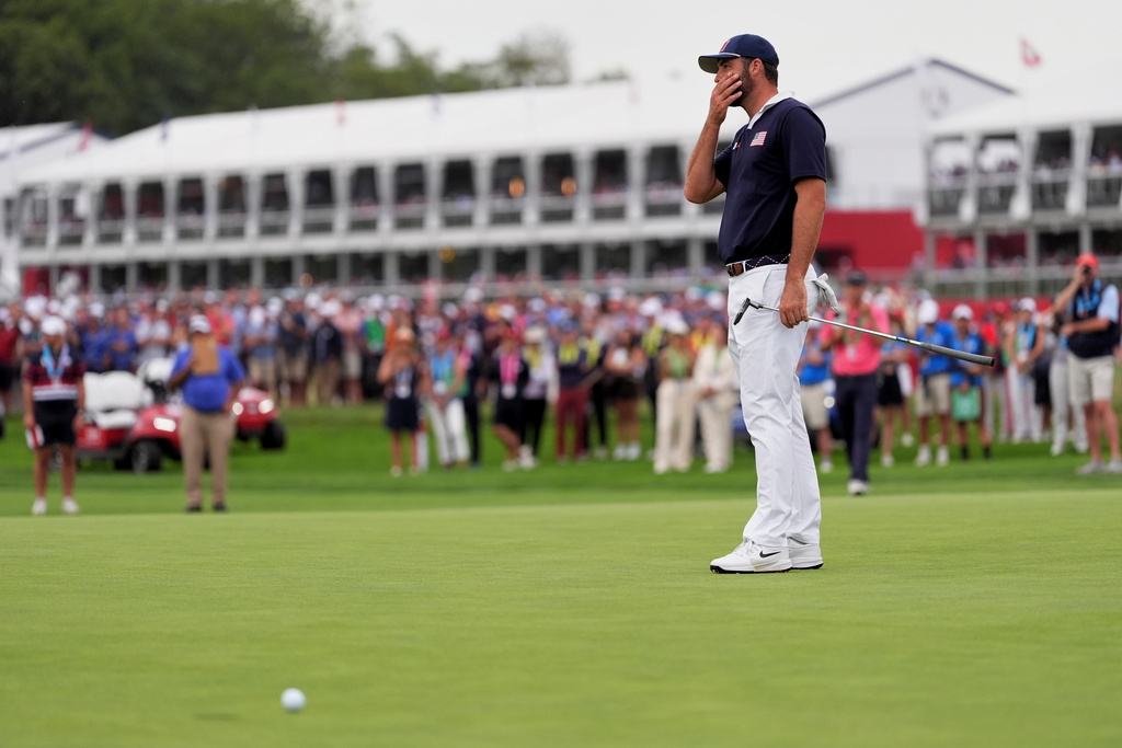 United States' Scottie Scheffler reacts after missing a putt on the 16th hole at Bethpage Black golf course during the Ryder Cup golf tournament, Saturday, Sept. 27, 2025, in Farmingdale, N.Y. (AP Photo/Lindsey Wasson)