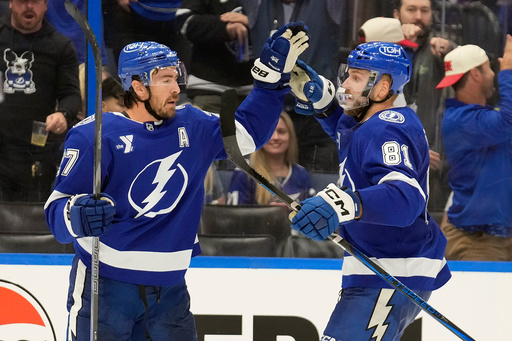 Tampa Bay Lightning defenseman Ryan McDonagh (27) celebrates his goal against the Chicago Blackhawks with defenseman Erik Cernak (81) during the second period of an NHL hockey game Thursday, Oct. 23, 2025, in Tampa, Fla. (AP Photo/Chris O'Meara) Tampa Bay Lightning defenseman Ryan McDonagh (27) celebrates his goal against the Chicago Blackhawks with defenseman Erik Cernak (81) during the second period of an NHL hockey game Thursday, Oct. 23, 2025, in Tampa, Fla. (AP Photo/Chris O'Meara)