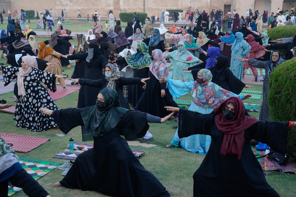 People practice yoga during a celebration of the International Yoga Day in Lahore, Pakistan, Sunday, Jun 21, 2026. (AP Photo/K.M. Chaudary)