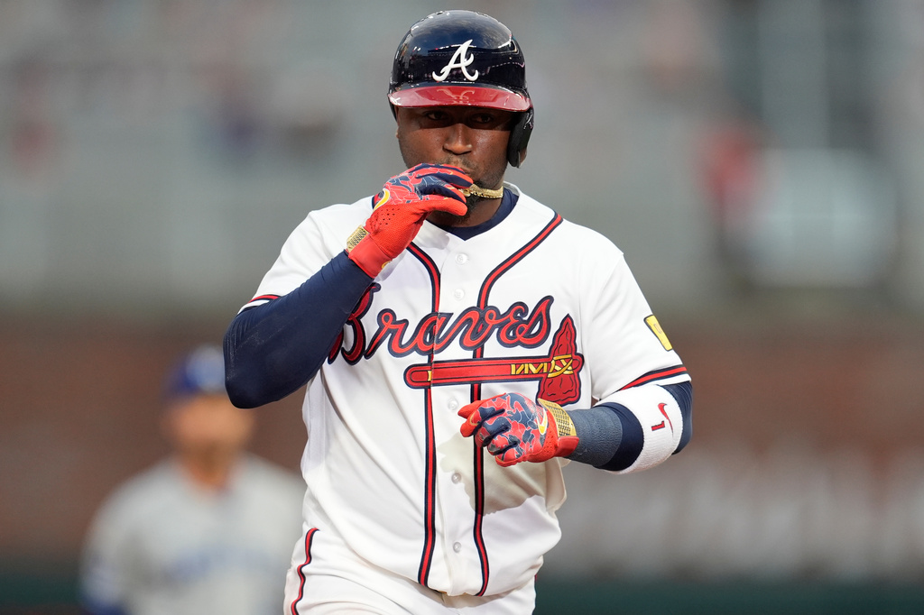 Atlanta Braves' Ozzie Albies (1) celebrates his solo homer against the Kansas City Royals during the first inning of an opening-day baseball game, Friday, March 27, 2026, in Atlanta. (AP Photo/Mike Stewart)