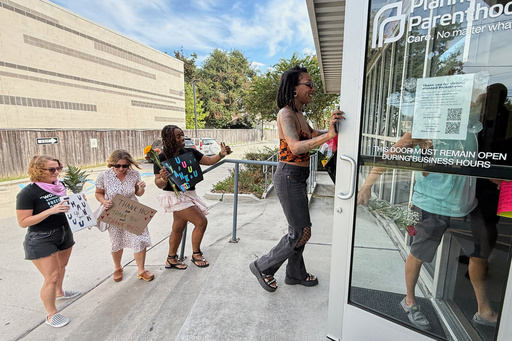 Members of Louisiana Coalition for Reproductive Freedom and supporters arrive at Planned Parenthood on the day they are closing, to deliver cards and flowers to the organization, in New Orleans, Tuesday, Sept. 30, 2025. (AP Photo/Gerald Herbert) Members of Louisiana Coalition for Reproductive Freedom and supporters arrive at Planned Parenthood on the day they are closing, to deliver cards and flowers to the organization, in New Orleans, Tuesday, Sept. 30, 2025. (AP Photo/Gerald Herbert)