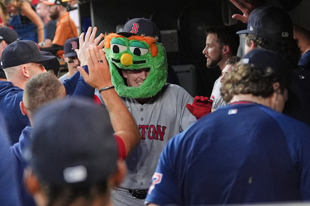Boston Red Sox' Adley Rutschman, center, celebrates with teammates after hitting a home run during the first inning of a baseball game against the Baltimore Orioles, Thursday, Sept. 3, 2026, in Baltimore. (AP Photo/Stephanie Scarbrough)