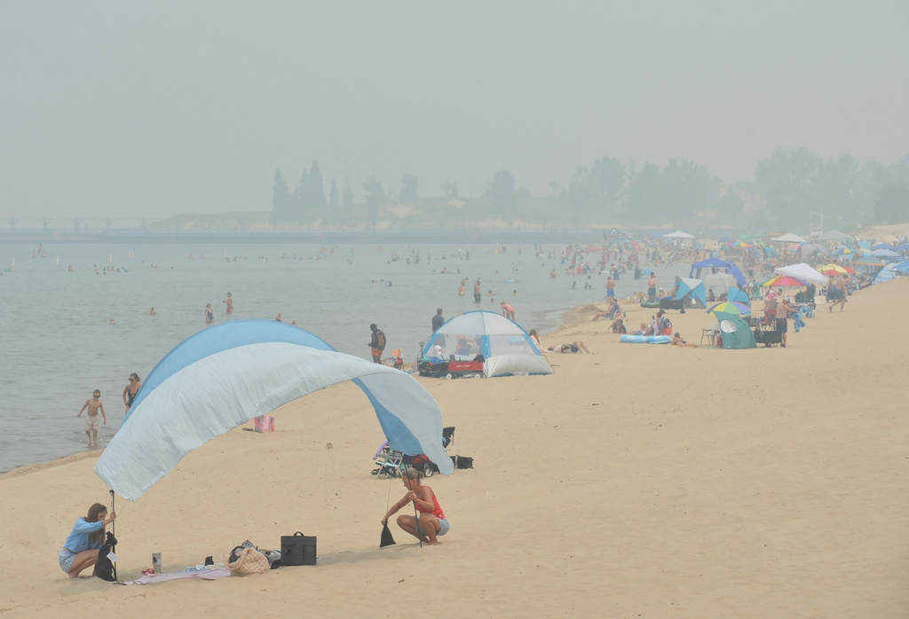 Hazy skies from Canadian wildfires cover Silver Beach and Lake Michigan, Thursday, July 16, 2026, in St. Joseph, Mich. (Don Campbell/The Herald-Palladium via AP)