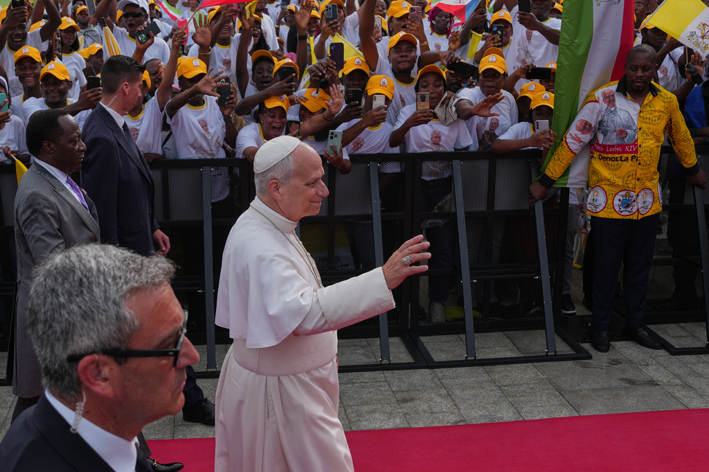 Pope Leo XIV waves to the faithful prior to the start of a meeting with representatives of the world of culture in Malabo, Equatorial Guinea, Tuesday, April 21, 2026, on the ninth day of his 11-day pastoral visit to Africa. (AP Photo/Misper Apawu)