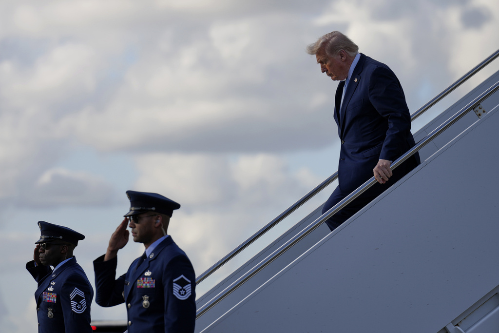 President Donald Trump steps off Air Force One, Friday, March 20, 2026, at Palm Beach International Airport in West Palm Beach, Fla. (AP Photo/Mark Schiefelbein)