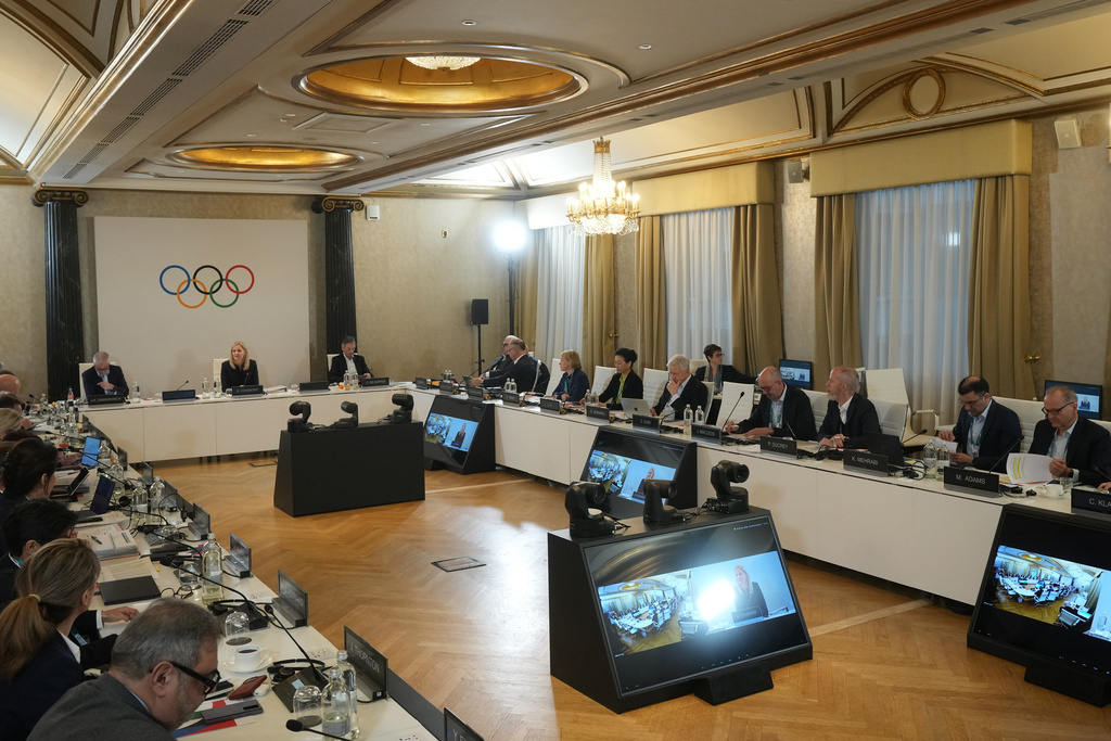 IOC President Kirsty Coventry, top center, sits at the head of the table at the start of the IOC Executive Board meeting at the 2026 Winter Olympics, in Milan, Italy, Saturday, Jan. 31, 2026. (AP Photo/Antonio Calanni, Pool)