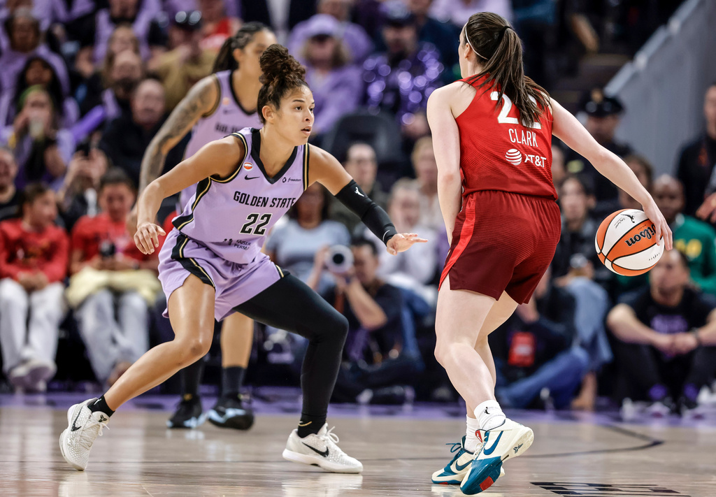 Indiana Fevers' Caitlin Clark (22) drives to the basket against Golden State Valkyries' Veronica Burton (22) during the first half of a WNBA basketball game in San Francisco on Thursday, May 28, 2026. (Carlos Avila Gonzalez/San Francisco Chronicle via AP)