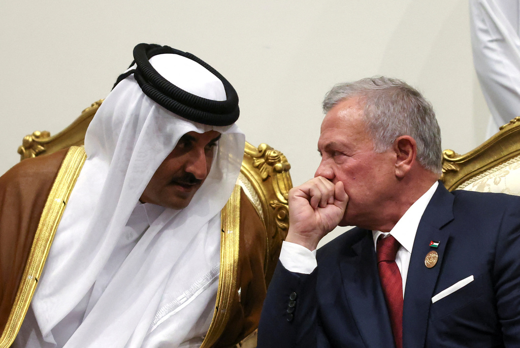 Emir of Qatar Sheikh Tamim ibn Hamad Al Thani and Jordan's King Abdullah, right, meet before attending a world leaders' summit on ending the Gaza war, in Sharm el-Sheikh, Egypt, Monday, Oct. 13, 2025. (Suzanne Plunkett, Pool Photo via AP)