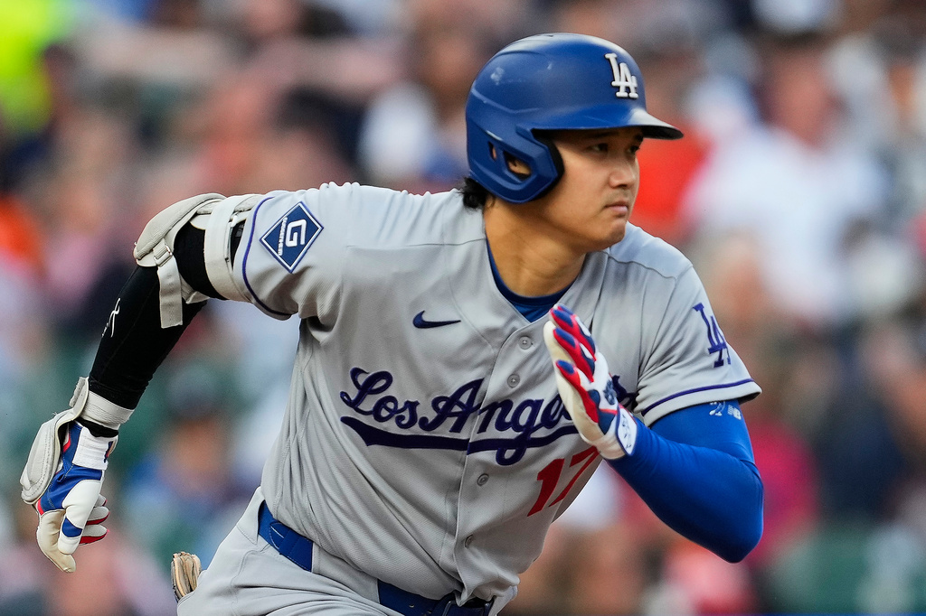Los Angeles Dodgers' Shohei Ohtani runs out a ground out against the Detroit Tigers during the third inning of a baseball game Friday, Aug. 28, 2026, in Detroit. (AP Photo/Paul Sancya)