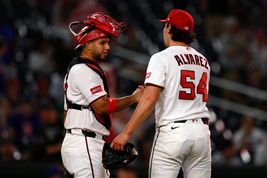Washington Nationals' Keibert Ruiz, left, and Andrew Alvarez celebrate after a baseball game against the New York Mets, Wednesday, May 20, 2026, in Washington. (AP Photo/Nick Wass)