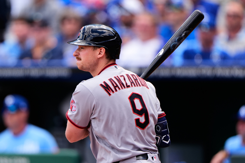 Cleveland Guardians' Kyle Manzardo watches histwo-run double during the first inning of a baseball game against the Kansas City Royals, Thursday, May 7, 2026, in Kansas City, Mo. (AP Photo/Charlie Riedel)