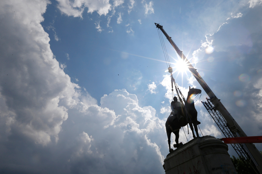 FLE - A crew removes the statue of Confederate Gen. Stonewall Jackson, July 1, 2020, in Richmond, Va. (AP Photo/Steve Helber, File)